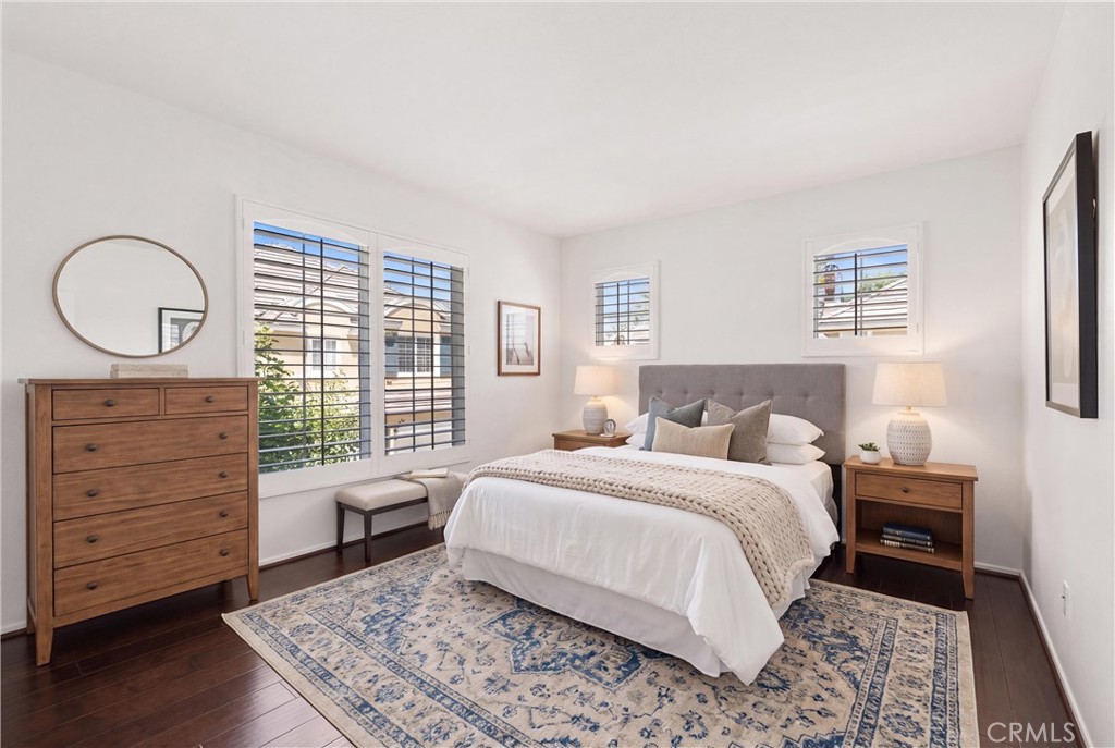*VIRTUALLY STAGED* Spacious secondary bedroom featuring engineered hardwood flooring, plantation shutters, and abundant - 15 Poppyfield, Rancho Santa Margarita CA 92688 - photo 25
