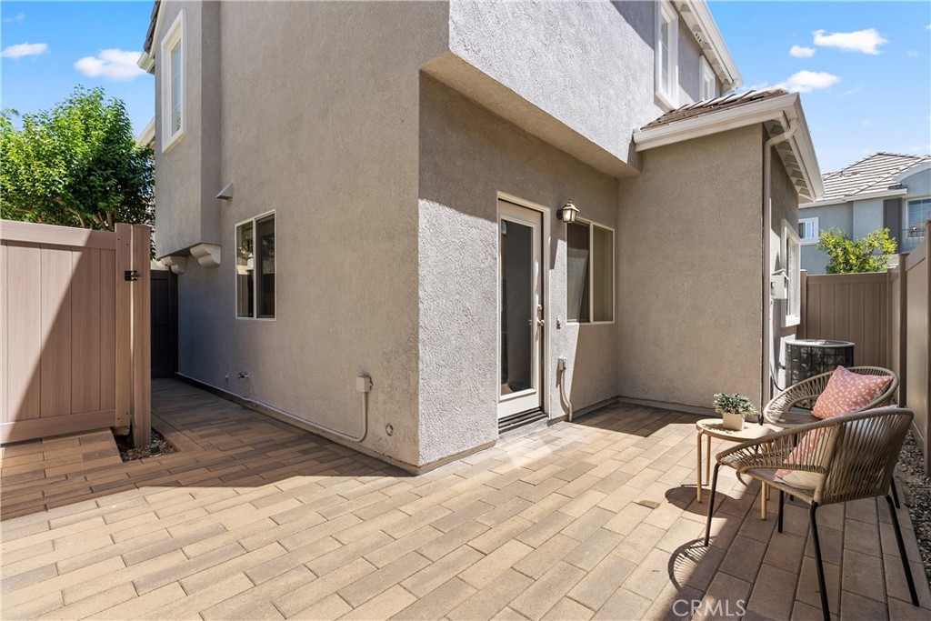 Designed for easy living, the spacious paver patio offers multiple seating areas and a private setting for entertaining, - 15 Poppyfield, Rancho Santa Margarita CA 92688 - photo 31