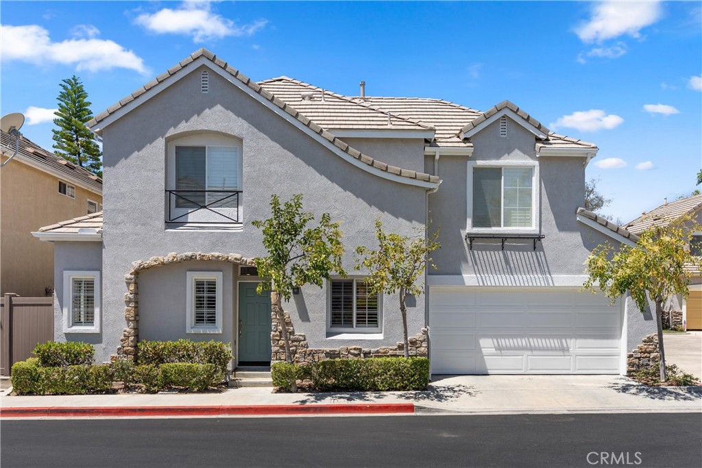 Beautiful corner residence showcasing attractive stone accents, mature landscaping, an attached two-car garage, and time - 15 Poppyfield, Rancho Santa Margarita CA 92688 - photo 36