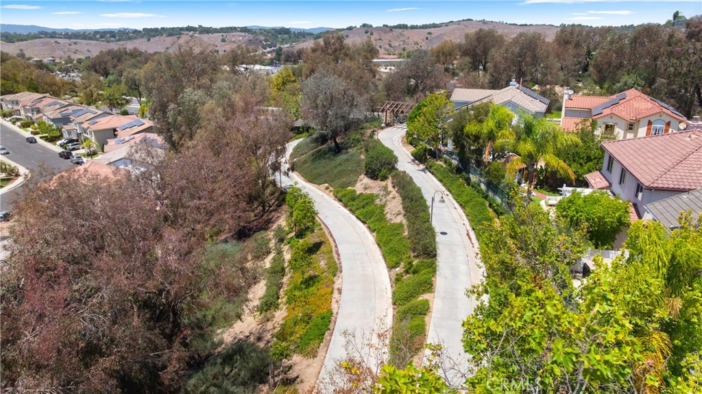 Enjoy direct access to beautifully maintained walking and biking trails that wind through mature trees, open greenbelts, - 15 Poppyfield, Rancho Santa Margarita CA 92688 - photo 37