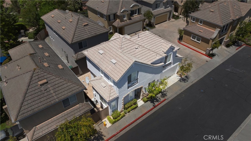 Corner-lot residence showcasing timeless Spanish-inspired architecture with a concrete tile roof, mature landscaping, an - 15 Poppyfield, Rancho Santa Margarita CA 92688 - photo 41