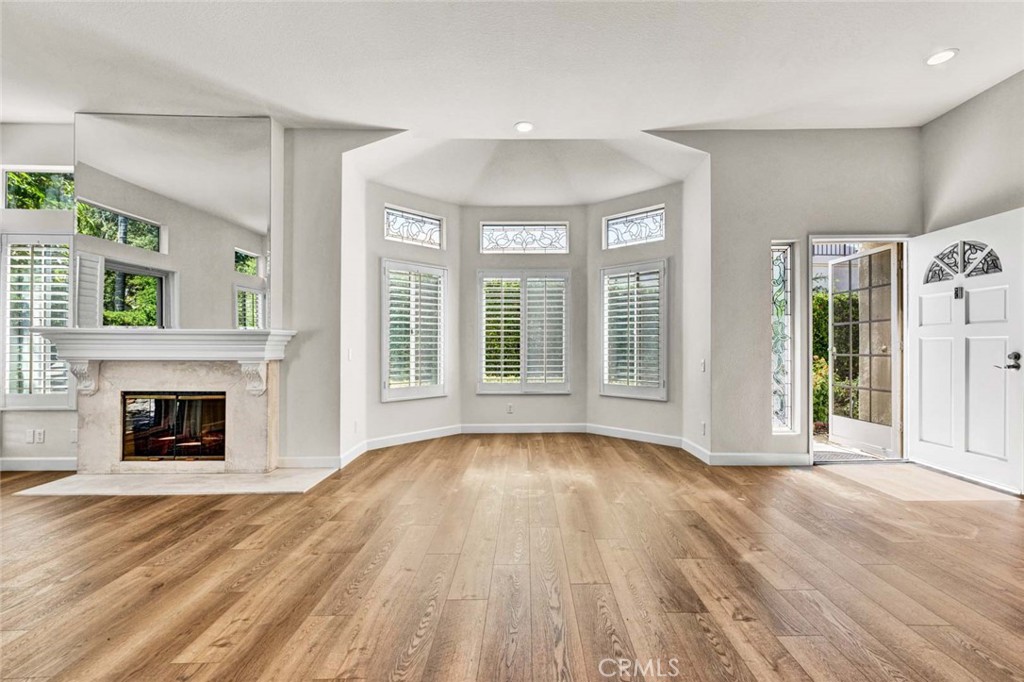 Expansive Living Room with Dining Area Centered Around an Exquisite Marble Fireplace - 16 Calle Maria, Rancho Santa Margarita CA 92688 - photo 1