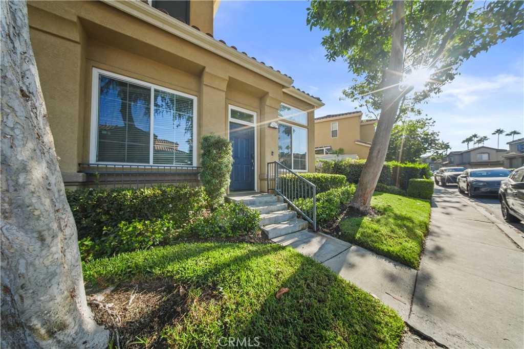 Sidewalk view of 17 Calle de Los Ninos LETS ENTER Entryway - 17 Calle De Los Ninos, Rancho Santa Margarita CA 92688 - photo 4