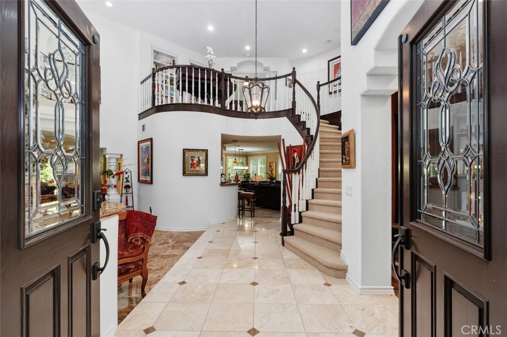 Step through the dramatic double doors with leaded glass panels into a soaring two story foyer that immediately impresse - 21792 Hermosa Lane, Rancho Santa Margarita CA 92679 - photo 2