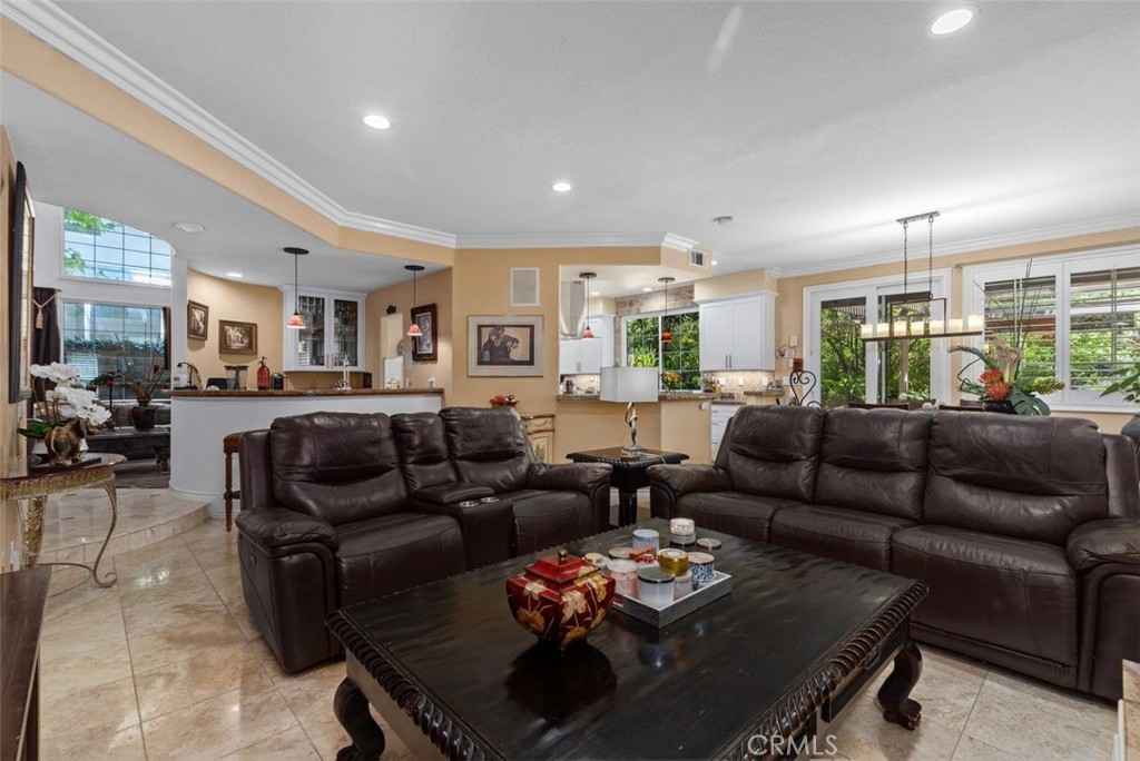 This expansive view captures the seamless open flow between the family room, granite topped bar, remodeled kitchen, and - 21792 Hermosa Lane, Rancho Santa Margarita CA 92679 - photo 16