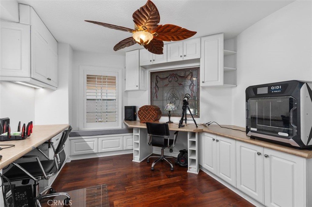 The fifth bedroom is currently configured as a home office featuring wraparound custom built in cabinetry and desk space - 21792 Hermosa Lane, Rancho Santa Margarita CA 92679 - photo 33