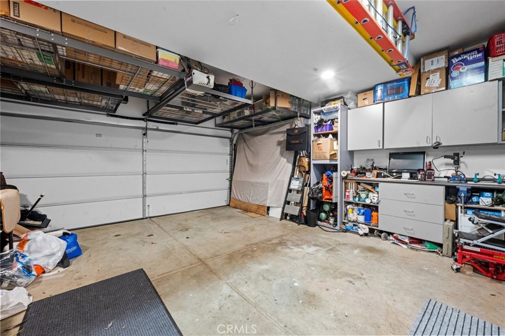 2 Car Garage w/storage racks - 25 Castilla, Rancho Santa Margarita CA 92688 - photo 34