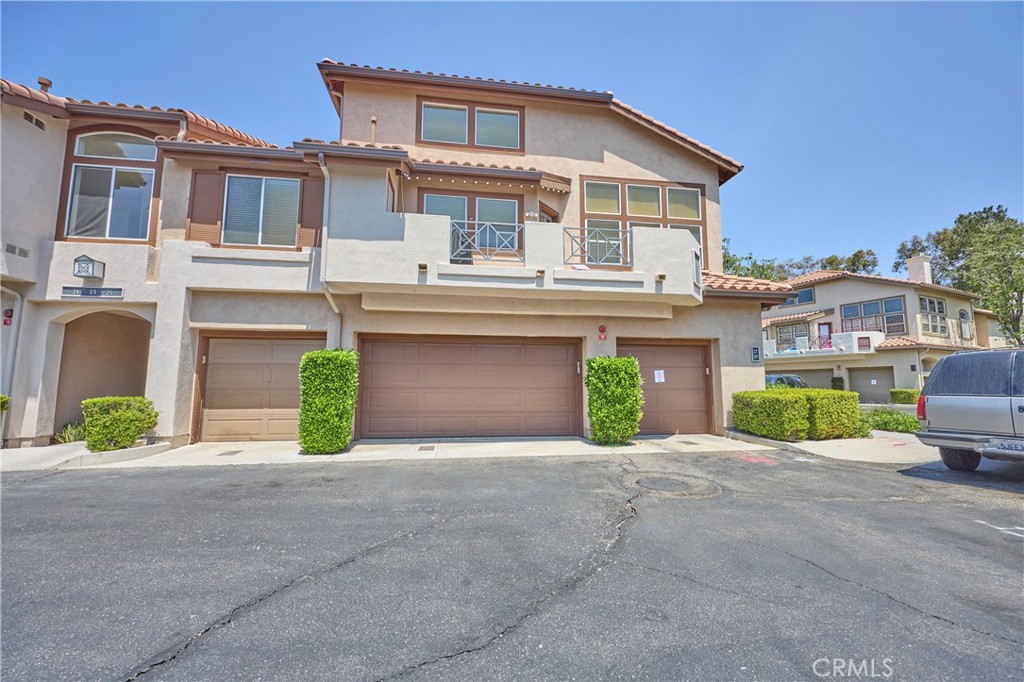 The unit is the single car unit on the left - 25 Paseo Estrellas, Rancho Santa Margarita CA 92688 - photo 1