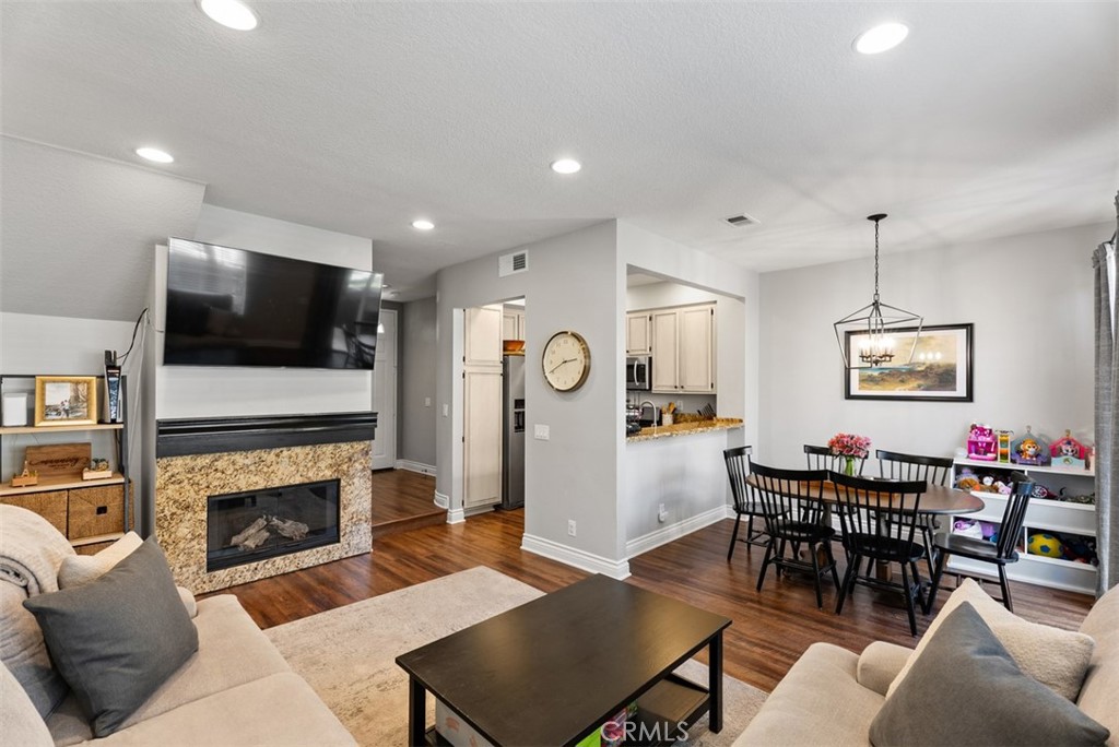Living Room Opens to Kitchen and Dining Area - 254 Pasto Rico, Rancho Santa Margarita CA 92688 - photo 1