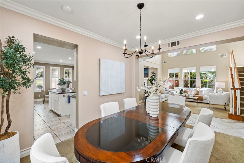 The living room is complemented by a formal dining room ideal for entertaining. - 30 Acanthus, Rancho Santa Margarita CA 92688 - photo 5