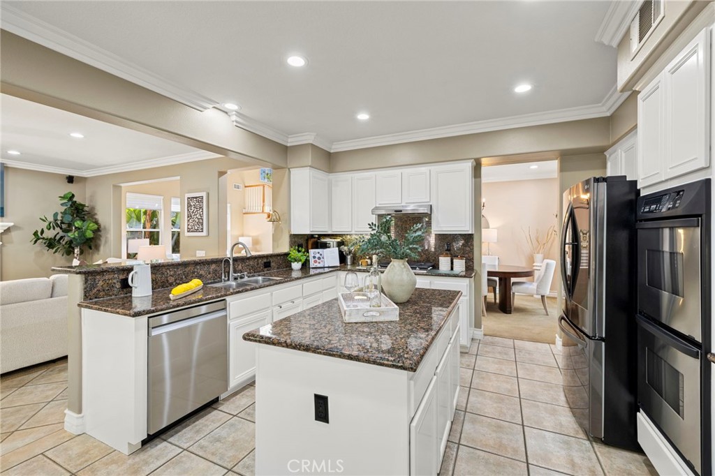 There is a pantry and center island in the kitchen. - 30 Acanthus, Rancho Santa Margarita CA 92688 - photo 9