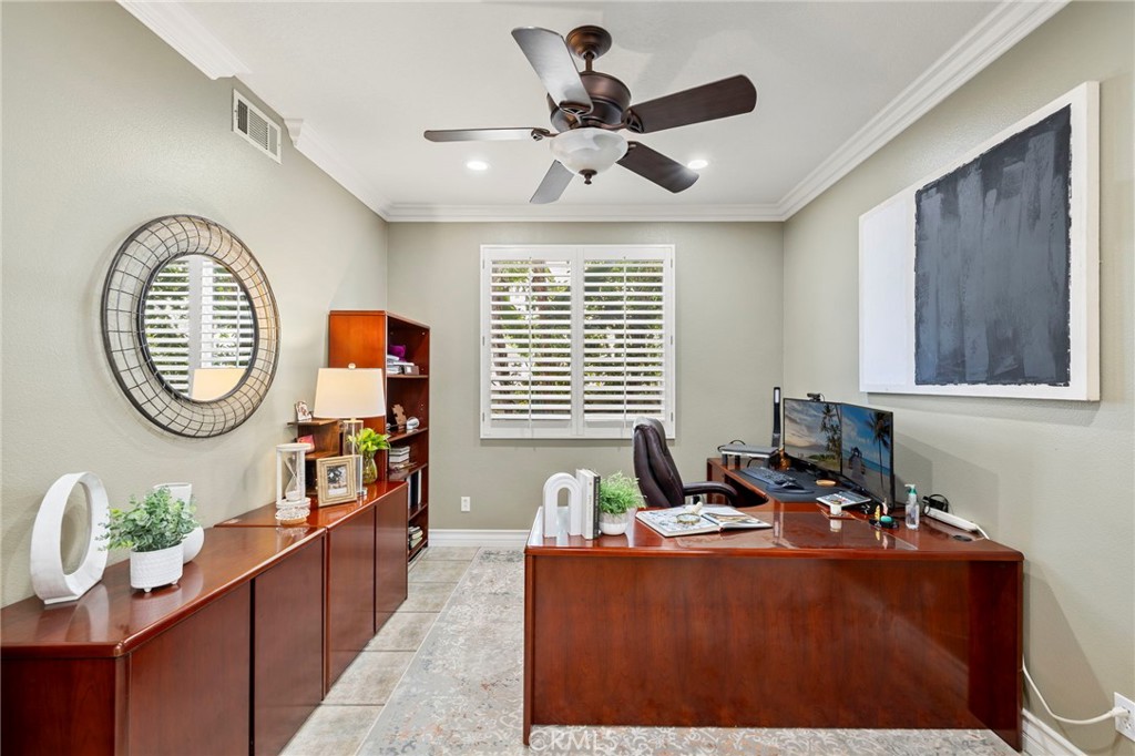 The optional downstairs bedroom, currently being used as an office, features double glass doors and plantation shutters. - 30 Acanthus, Rancho Santa Margarita CA 92688 - photo 16