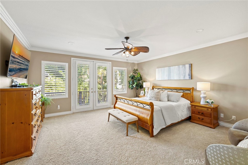 Upstairs, the spacious primary suite offers French doors opening onto a balcony. - 30 Acanthus, Rancho Santa Margarita CA 92688 - photo 20