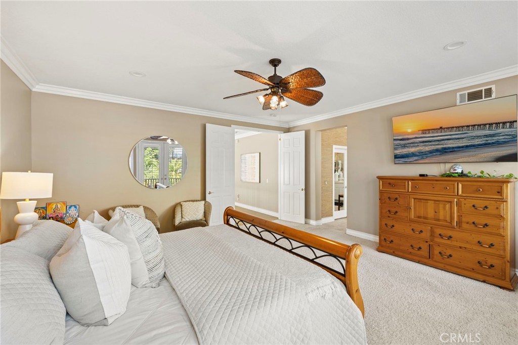 There is a ceiling fan and two walk-in closets in the primary suite. - 30 Acanthus, Rancho Santa Margarita CA 92688 - photo 21