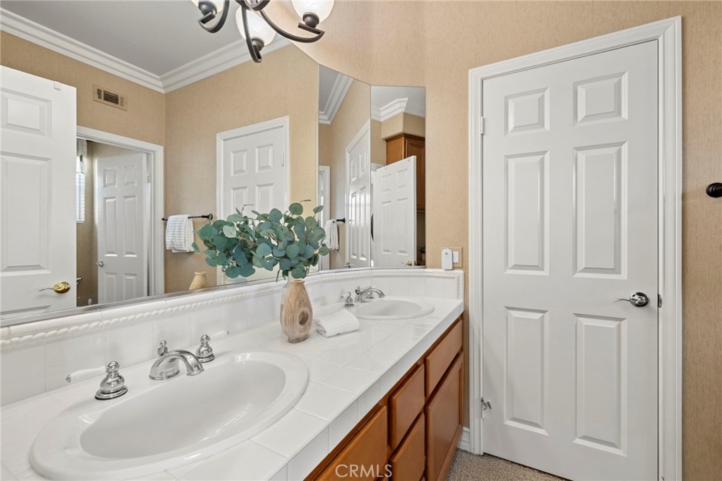 Guest bathroom with direct access from one bedrooms is located upstairs. - 30 Acanthus, Rancho Santa Margarita CA 92688 - photo 30
