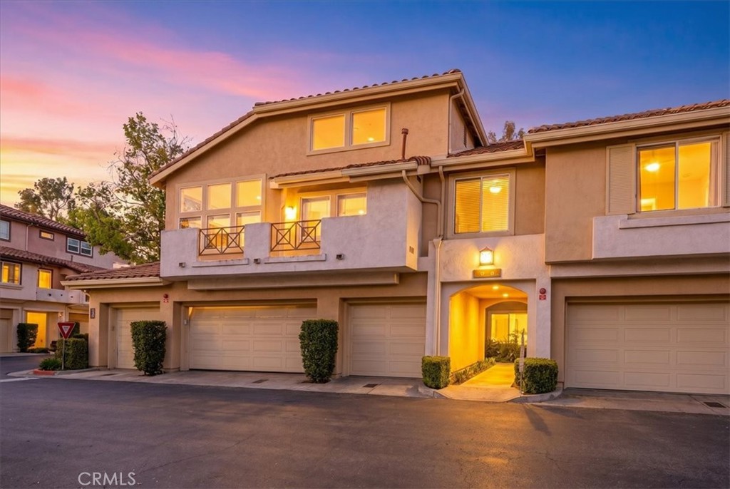 Exterior front view showcasing curb appeal and modern façade. - 30 Paseo Estrellas, Rancho Santa Margarita CA 92688 - photo 1