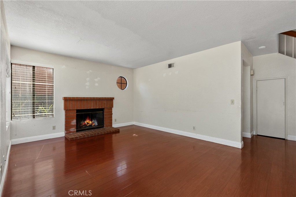 Family room - simulated fire in fireplace. - 30 San Bonifacio, Rancho Santa Margarita CA 92688 - photo 15