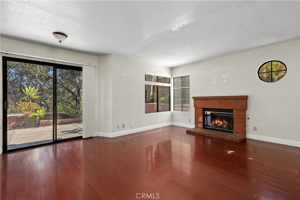 Family room looking towards back yard - simulated fire in fireplace. - 30 San Bonifacio, Rancho Santa Margarita CA 92688 - photo 16