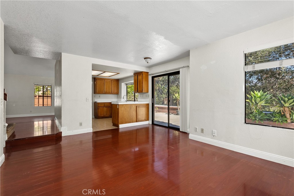 Family room looking towards kitchen and entry to the left. - 30 San Bonifacio, Rancho Santa Margarita CA 92688 - photo 17