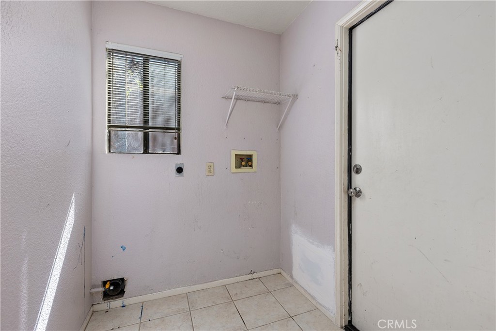 Inside laundry with garage access to the right. - 30 San Bonifacio, Rancho Santa Margarita CA 92688 - photo 18