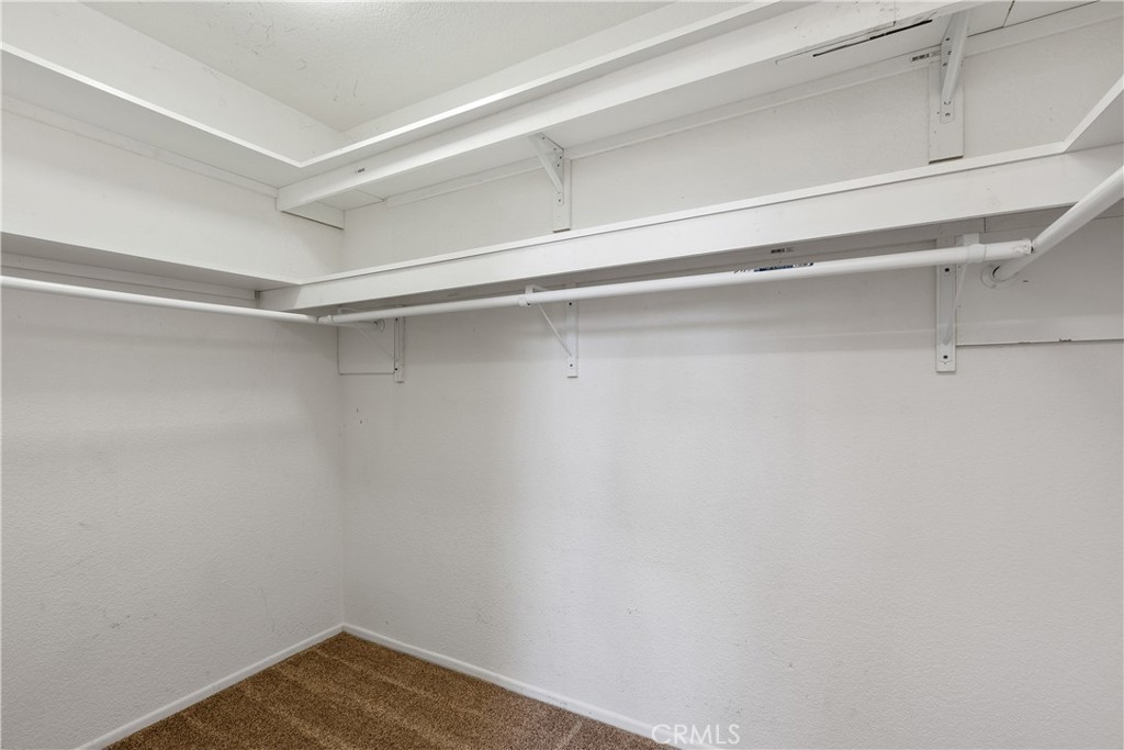Walk-in closet in master bedroom. - 30 San Bonifacio, Rancho Santa Margarita CA 92688 - photo 23