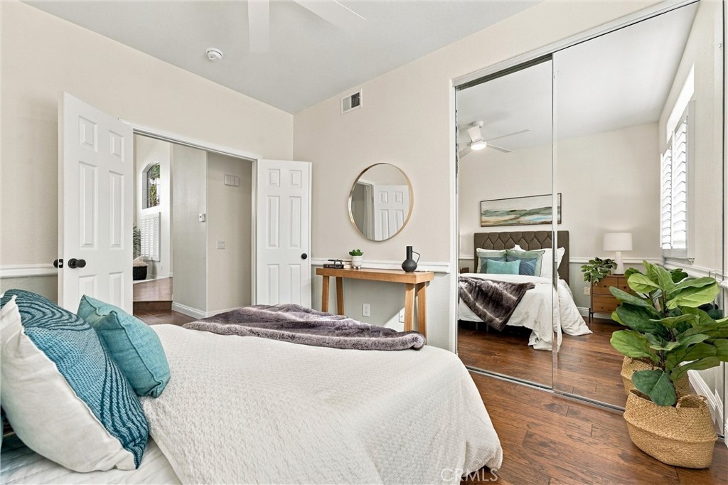Main floor bedroom with mirrored wardrobes - 32922 Brookseed, Rancho Santa Margarita CA 92679 - photo 21