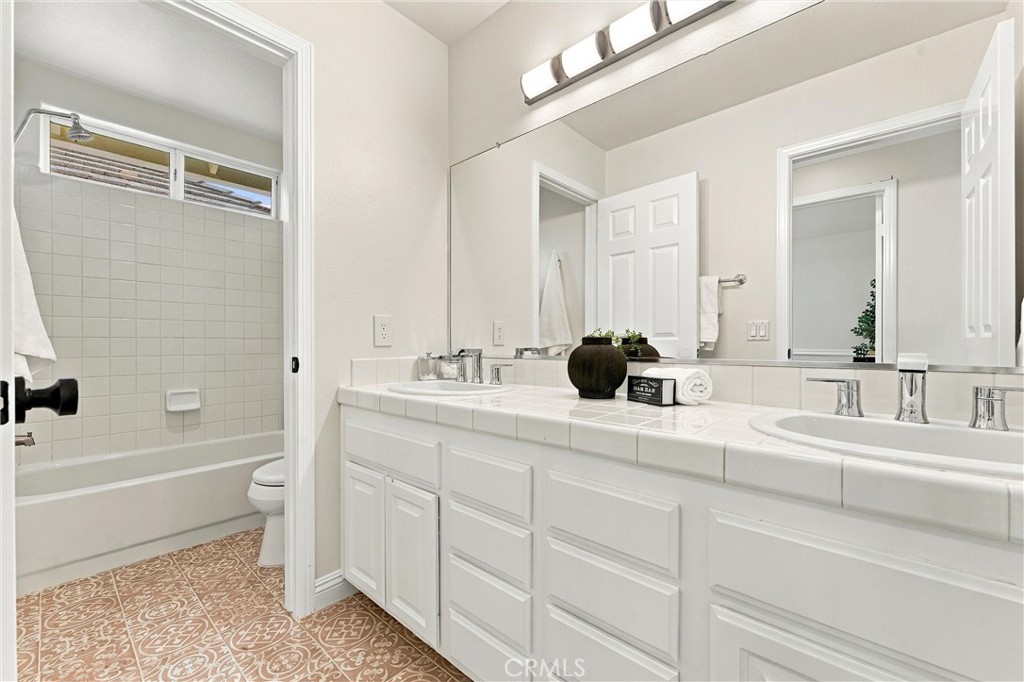 Upstairs secondary bath with double vanity sinks - 32922 Brookseed, Rancho Santa Margarita CA 92679 - photo 28