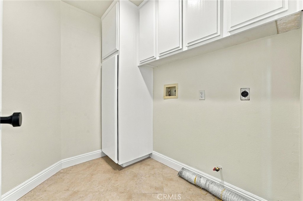 Inside laundry room with storgae and a sink - 32922 Brookseed, Rancho Santa Margarita CA 92679 - photo 49