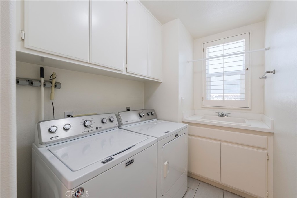 Laundry room with convenient sink. - 42 Via Brida, Rancho Santa Margarita CA 92688 - photo 19