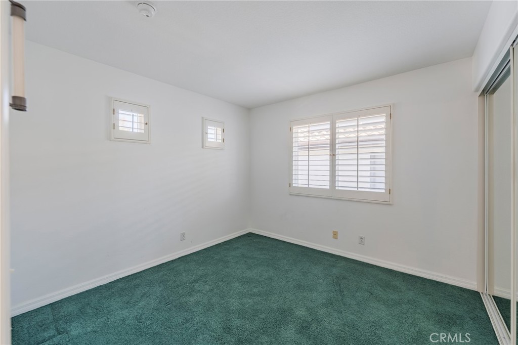 2nd bedroom with mirror closet doors - 42 Via Brida, Rancho Santa Margarita CA 92688 - photo 27