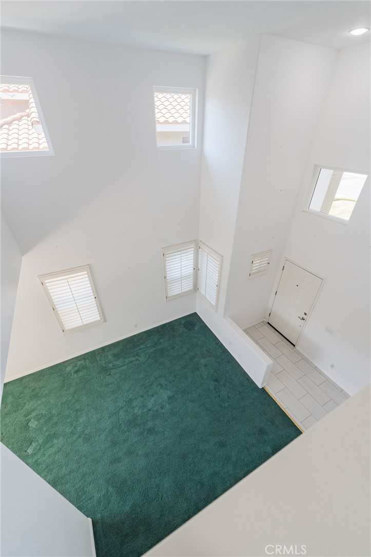 Looking down in living area from upstairs landing! Tons of windows - 42 Via Brida, Rancho Santa Margarita CA 92688 - photo 33