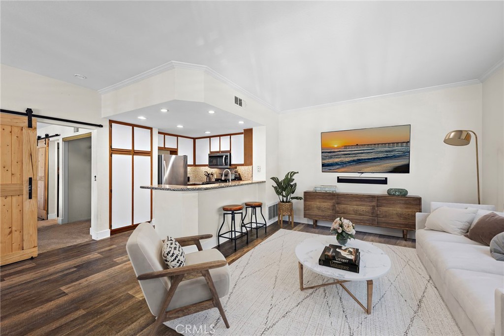 Furnishings in family and dining rooms have been virtually staged - 55 Rabano 240, Rancho Santa Margarita CA 92688 - photo 1