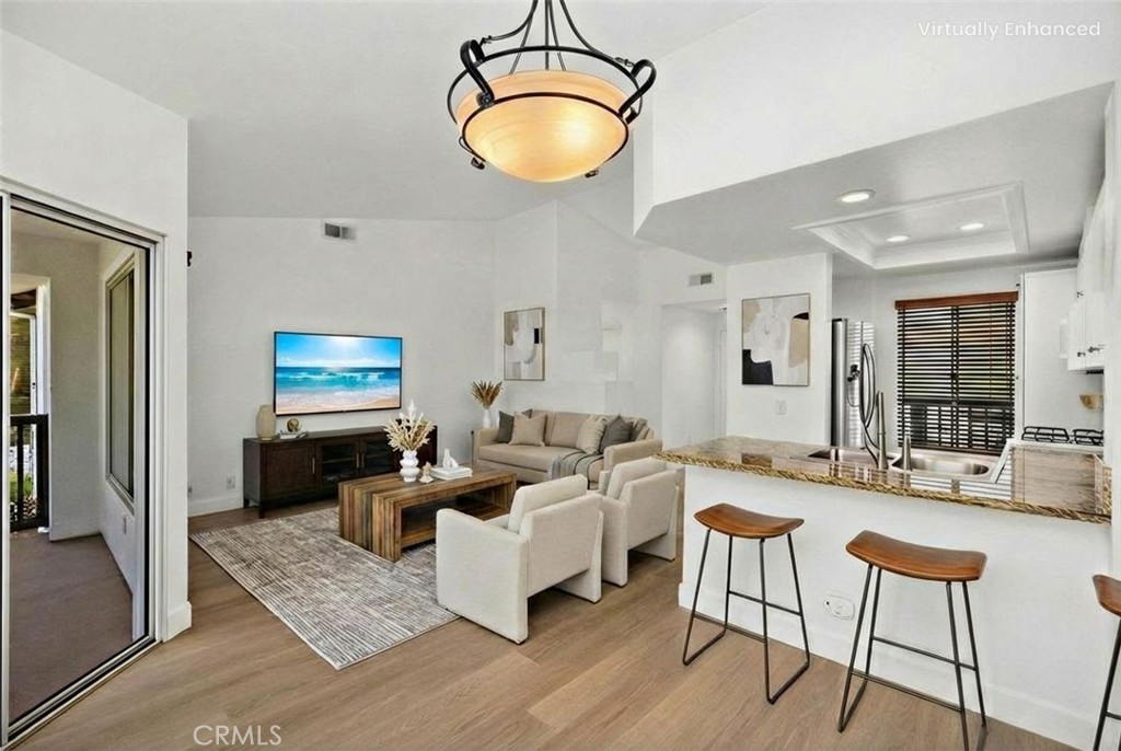 Living Room, Kitchen, and Dining Area ** Living Room, Kitchen, and Dining Area **Virtually Staged - 61 Rabano, Rancho Santa Margarita CA 92688 - photo 1