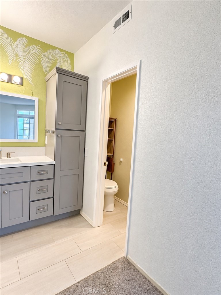 Cabinetry and enclosed toilet - 9 De Lino, Rancho Santa Margarita CA 92688 - photo 23