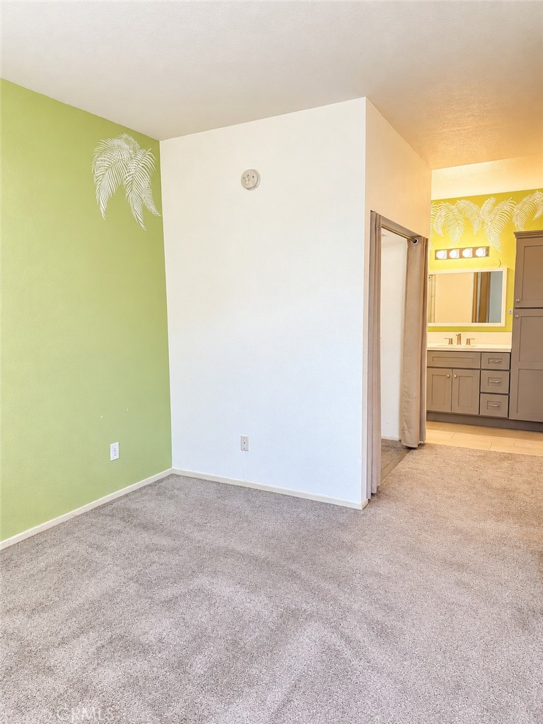 Bedroom with walk in close view and bathroom - 9 De Lino, Rancho Santa Margarita CA 92688 - photo 27