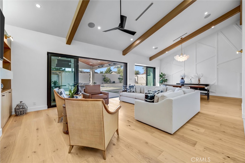 Living room looking out to pool and patio area - 11444 Harrisburg Road, Rossmoor CA 90720 - photo 5