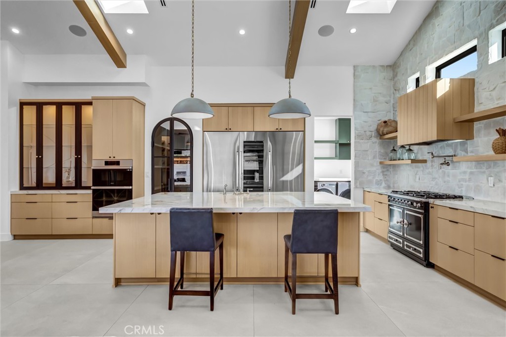 kitchen eating area and La Cornur French 6-burner range - 11444 Harrisburg Road, Rossmoor CA 90720 - photo 19