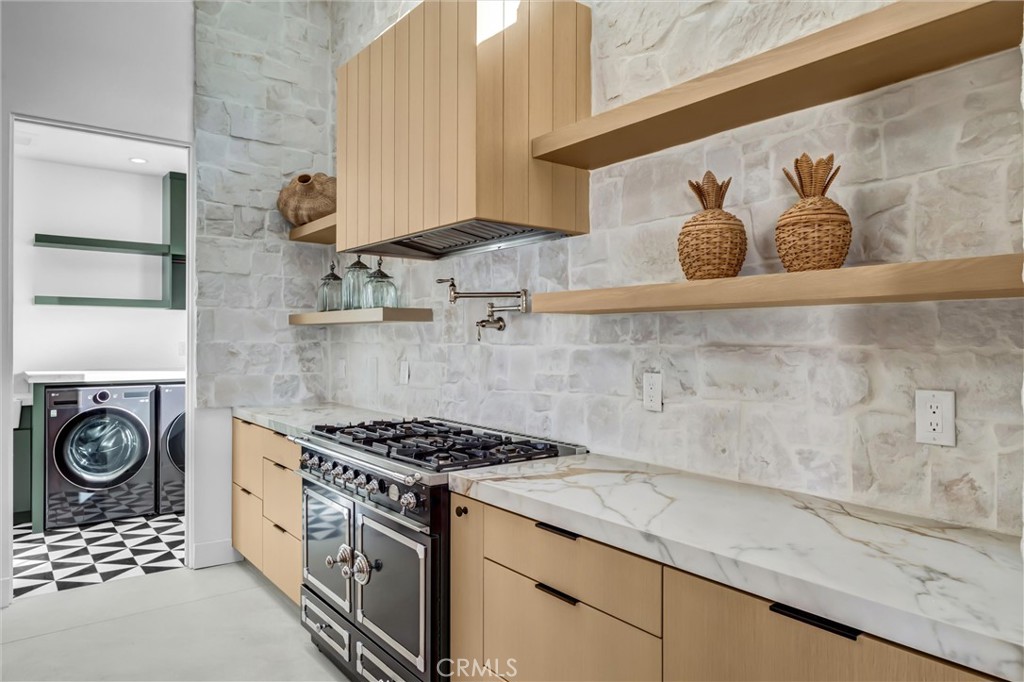 kitchen LaCornue French 6 - burner range and entry to laundry room - 11444 Harrisburg Road, Rossmoor CA 90720 - photo 20