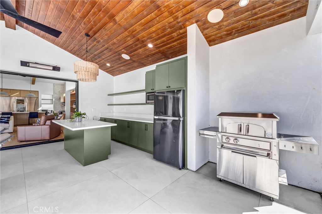 outdoor kitchen with pizza oven - 11444 Harrisburg Road, Rossmoor CA 90720 - photo 52