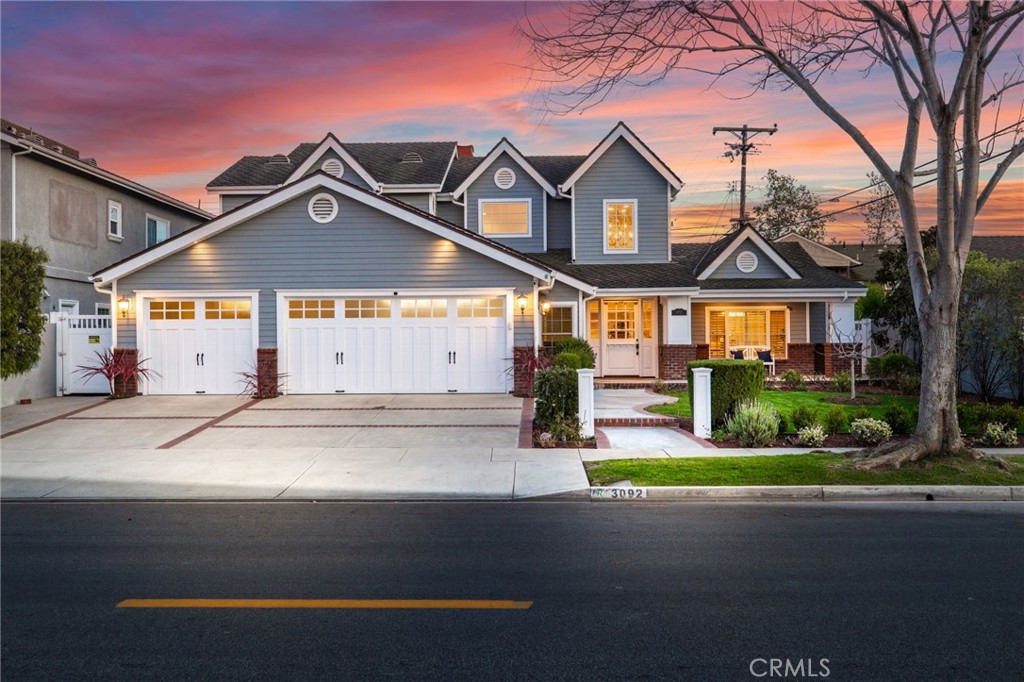 Front home view at twilight. - 3092 Copa de Oro Drive, Rossmoor CA 90720 - photo 1
