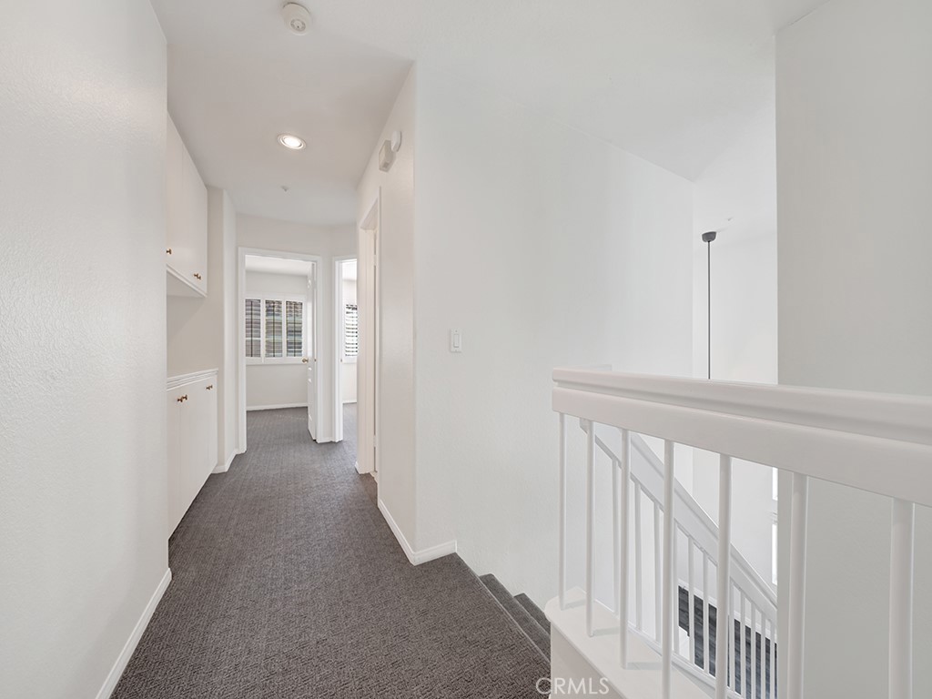 The upstairs hallway has an additional storage cabinet for linens and towels. - 1031 Via Presa, San Clemente CA 92672 - photo 14