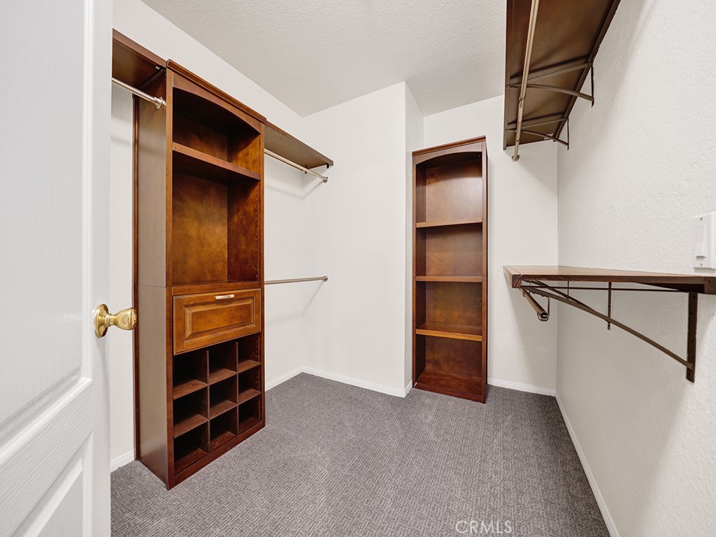 The primary bedroom's spacious walk in closet also has built ins. - 1031 Via Presa, San Clemente CA 92672 - photo 17