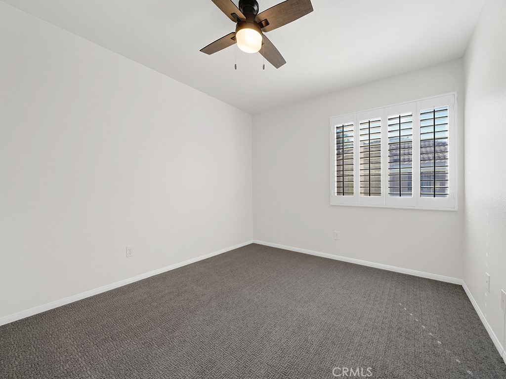 One of the upstairs guest bedrooms has a ceiling fan and a spacious walk in closet. - 1031 Via Presa, San Clemente CA 92672 - photo 22