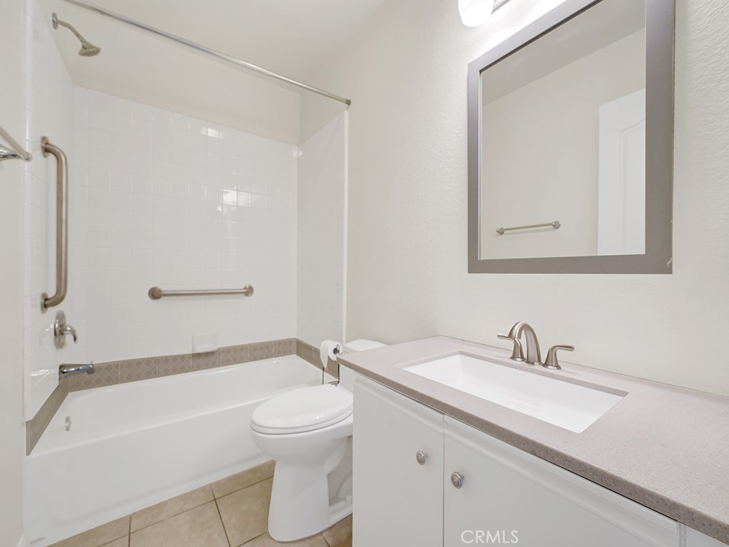 The upstairs guest bathroom has an updated vanity area and a shower tub combo. - 1031 Via Presa, San Clemente CA 92672 - photo 24