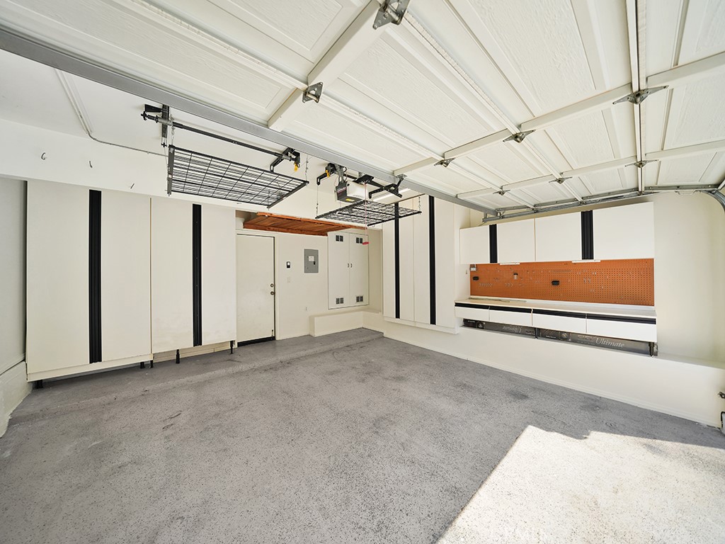 The garage also has plenty of storage cabinets and overhead racks as well. - 1031 Via Presa, San Clemente CA 92672 - photo 30