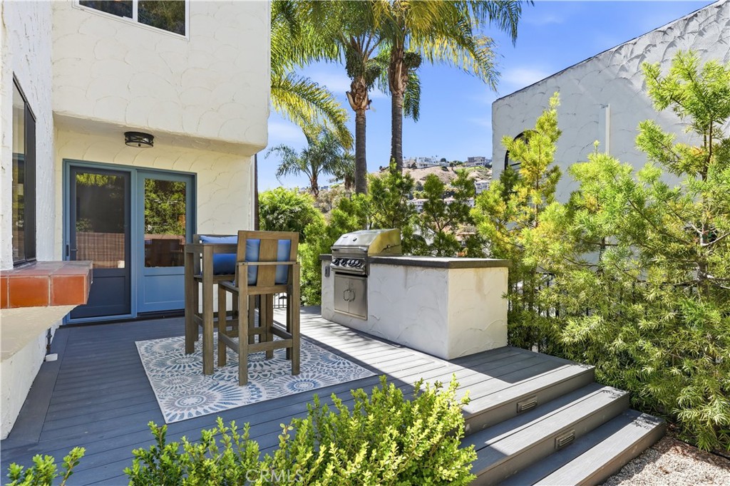 Dining Room leads to builtin BBQ island, firepit and multiple patio tables. - 106 Avenida Mesita, San Clemente CA 92673 - photo 16