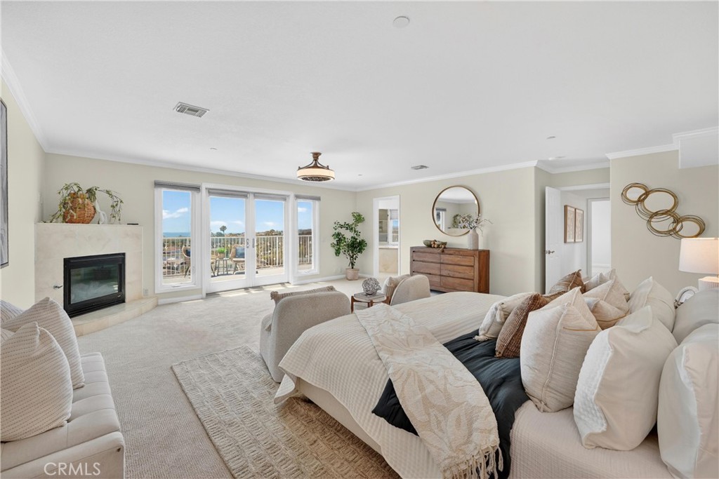 Primary suite with fireplace and ocean views - 111 Revuelta Court, San Clemente CA 92672 - photo 39