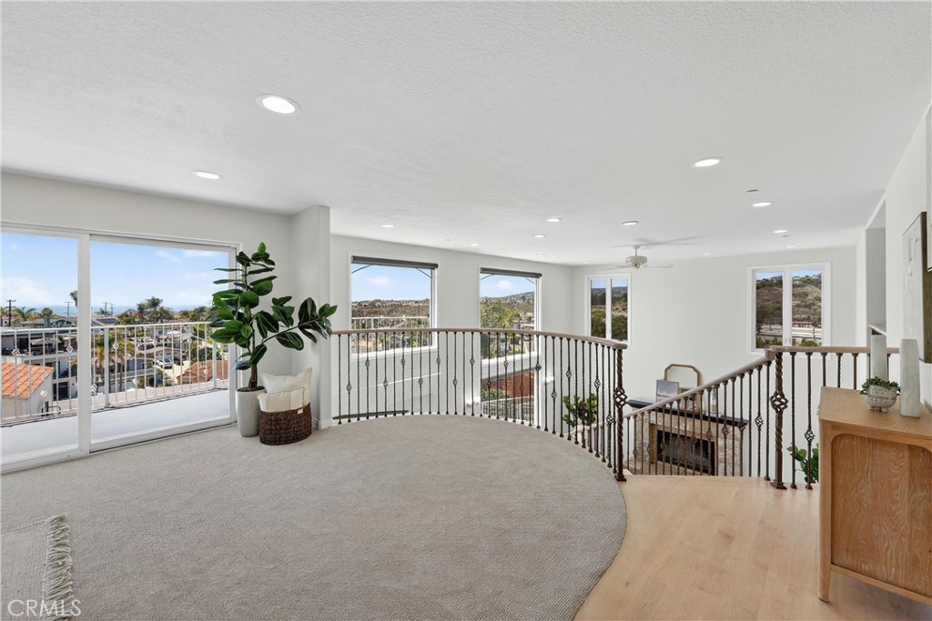 Spiral staircase leading downstairs - 111 Revuelta Court, San Clemente CA 92672 - photo 19