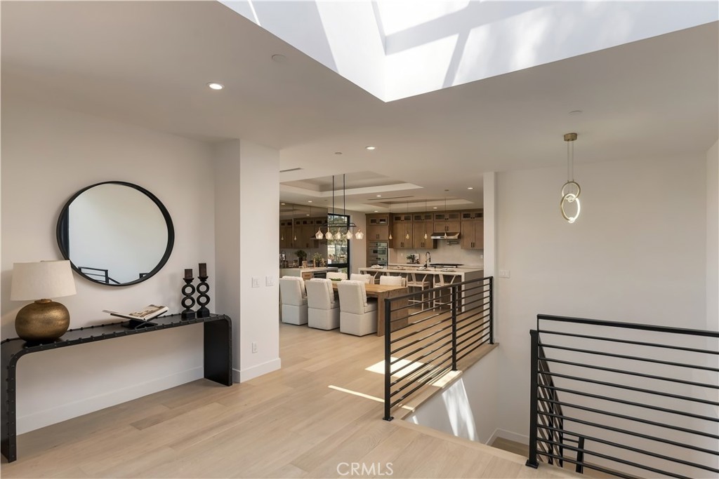 Skylight highlighting the entry and staircase to lower level - 126 Calle Redondel, San Clemente CA 92672 - photo 10
