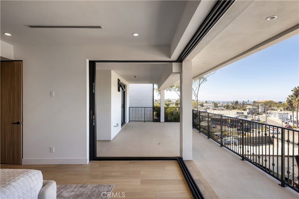 Primary:Walls of glass slide away, turning the bedroom into open air. - 126 Calle Redondel, San Clemente CA 92672 - photo 37